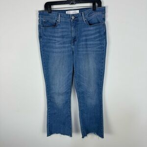 Levi's Mid Rise Boot Cut Medium Wash denim jeans fray raw hem